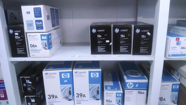 Printer cartridges on shelf